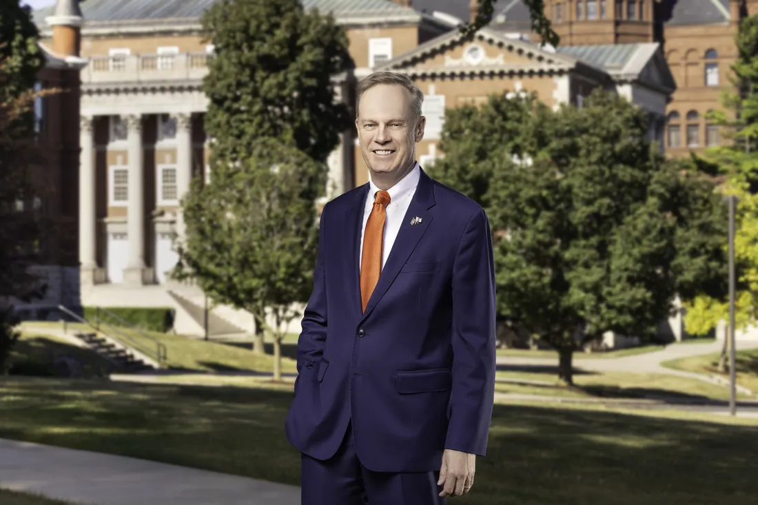 Chancellor Kent Syverud standing and smiling.
