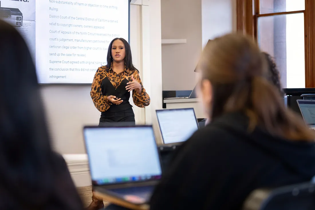 A person talking to a class.