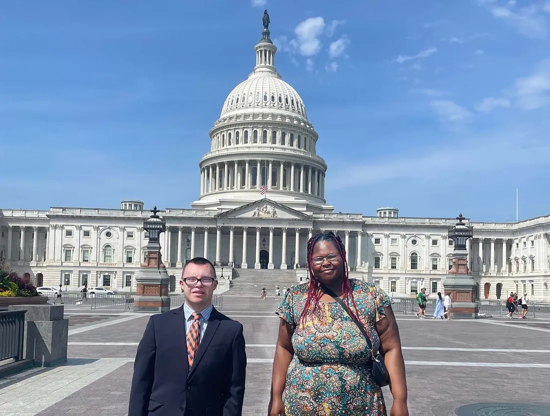 Two Inclusive U students outside the senate building.