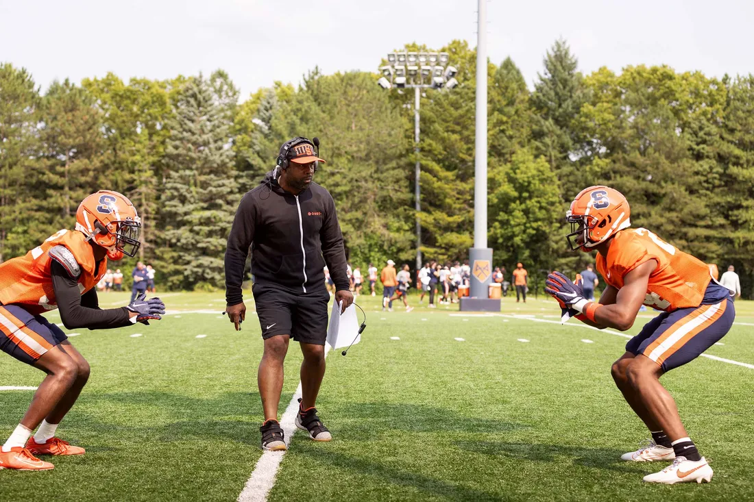 Fran Brown coaching football players.