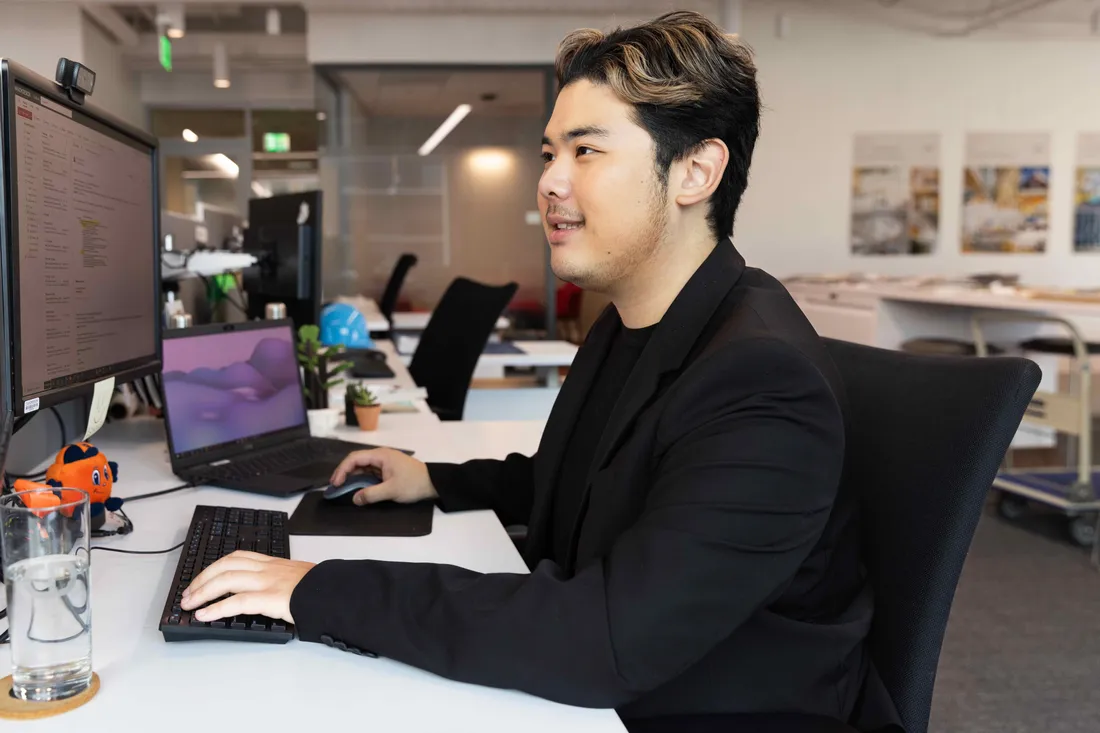 Student sitting on computer working.