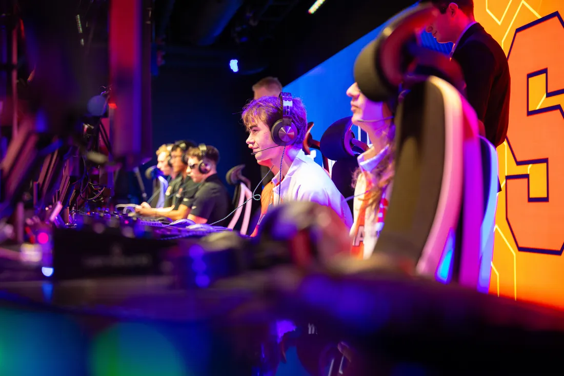 People playing on computers at the ESports Gaming Center Grand Opening.