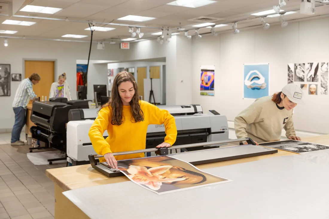 Student working at the state-of-the-art digital lab at Light Work inside the Robert B. Menschel Media center at Watson Hall.