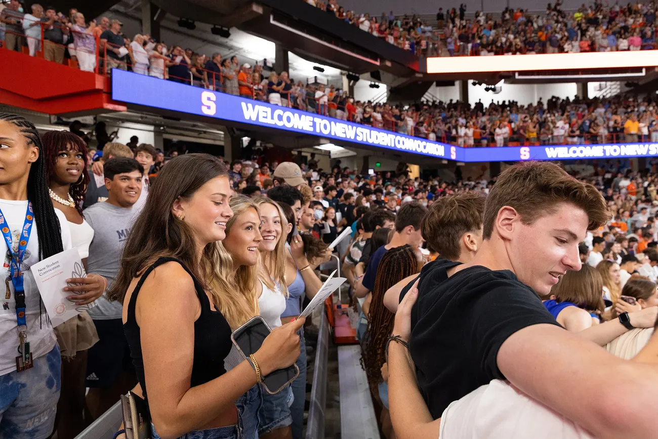 Crowd of students clapping in the dome.