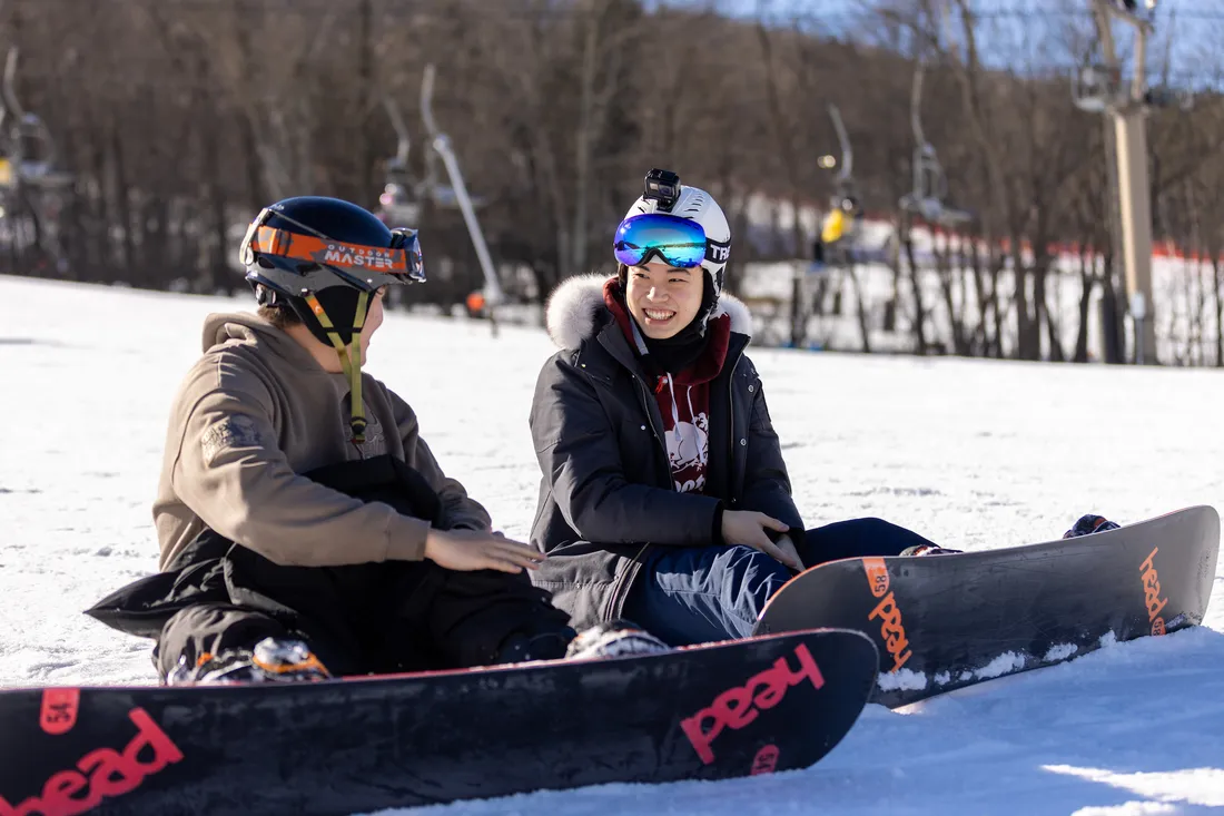 Two students snowboarding at Song Mountain.