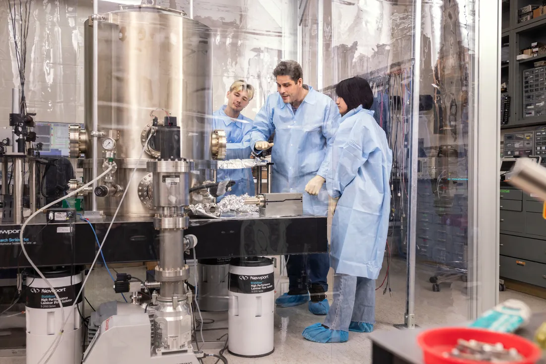 Student working on a gravitational waves research project in a laboratory.