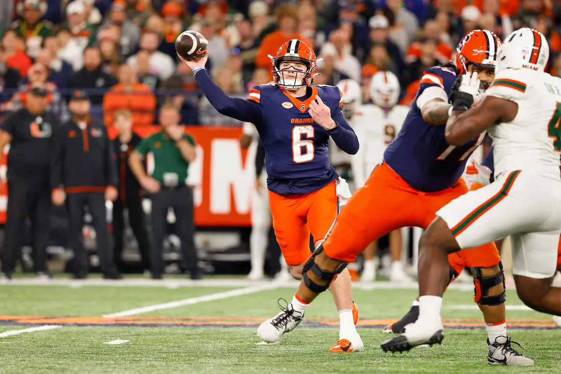 Kyle McCord catching a football during the Syracuse University vs. Miami game.