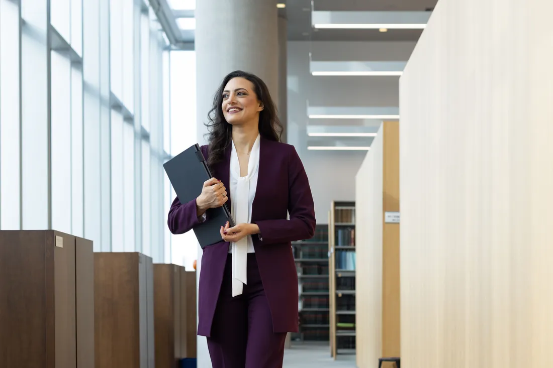 Law student, Omnia Shedid walking in Dineen Hall.