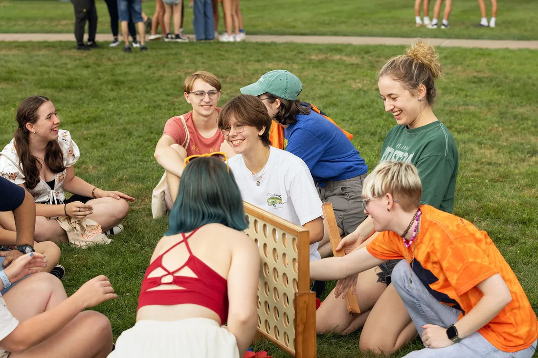 Students play Connect Four on quad.
