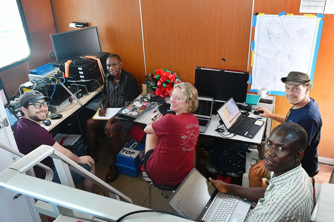 Members of a research team monitoring data.