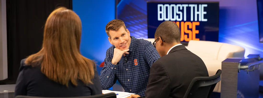 Scott Hansen talking to students during 2023 Boost the Cuse Broadcast.