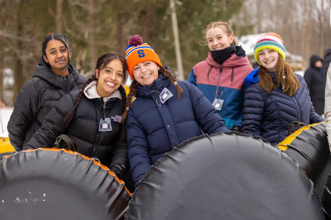 Five Students enjoy snow tubing.