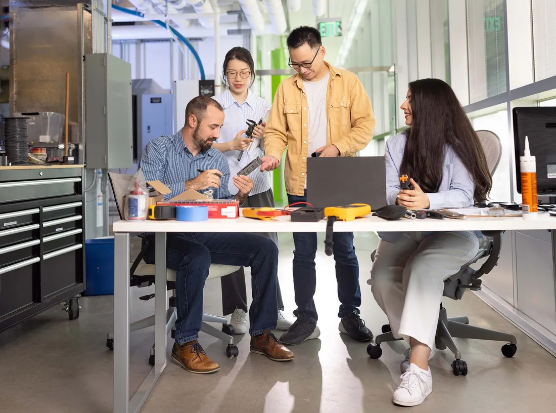 A group of students working at a table.