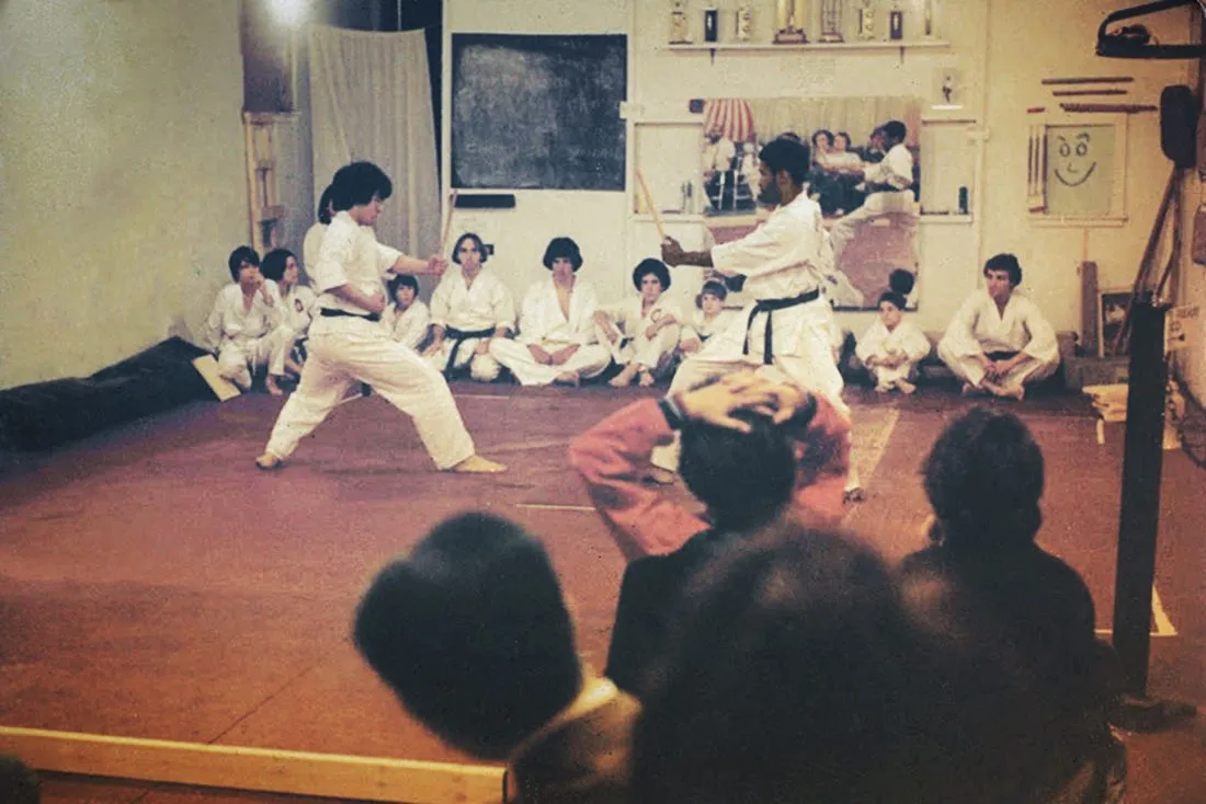 Martial arts fight taking place in a dojo