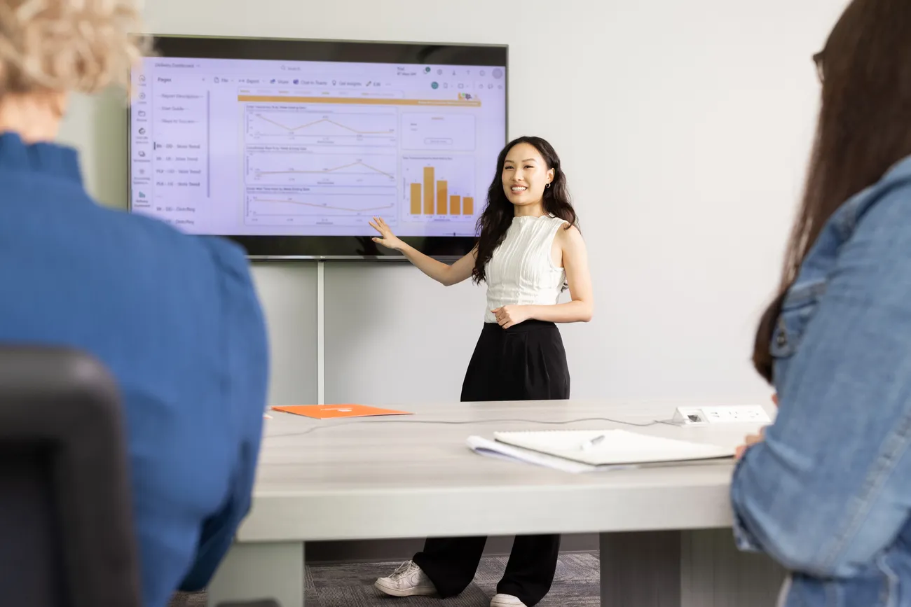 Student giving a presentation in a classroom.