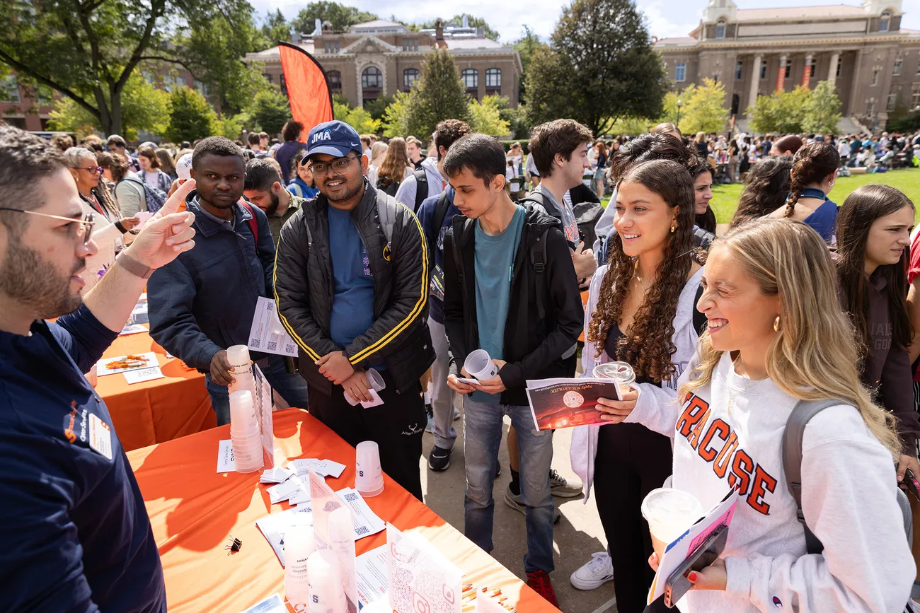 Students in line at a tabling event.