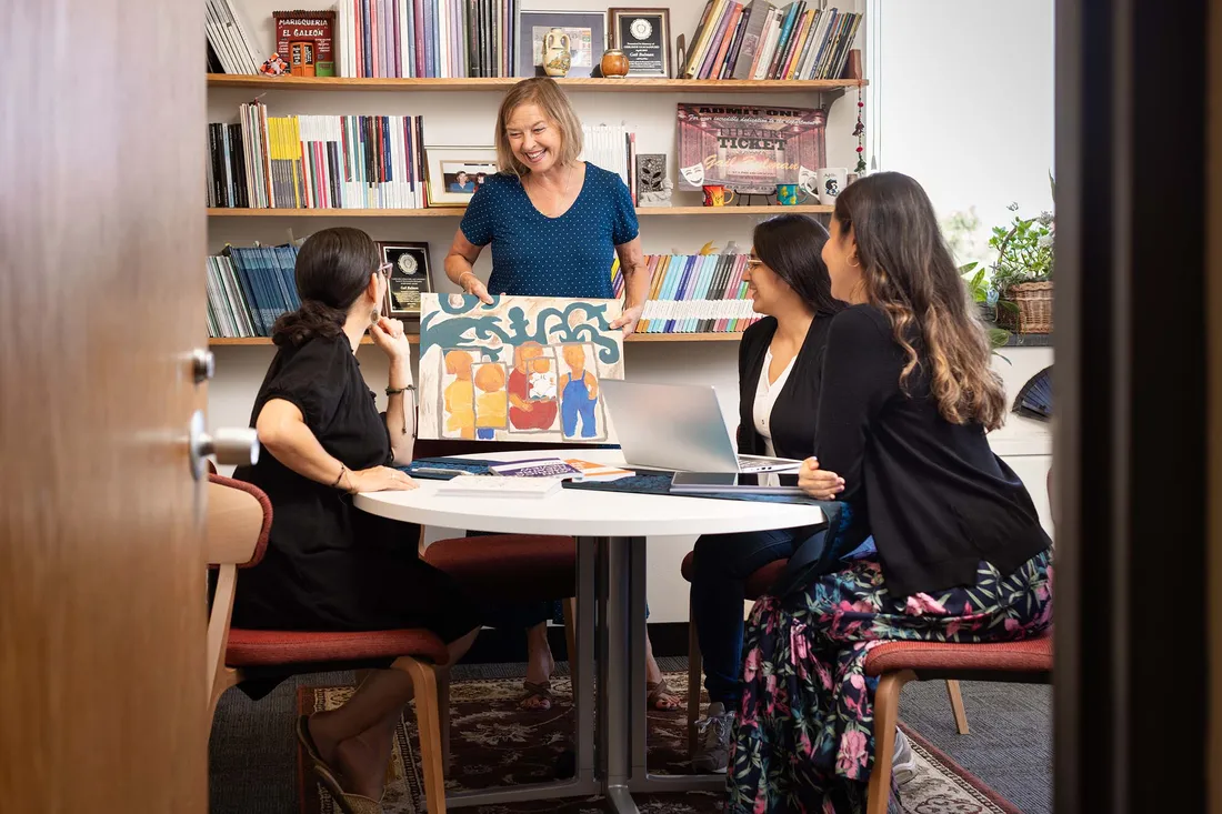 Gail Bulman talking with students.