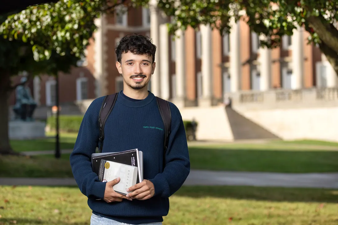 Jacob Grindstaff-Espinal outside a campus building at Syracuse University.