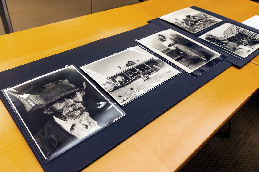Printed photos displayed on a table.