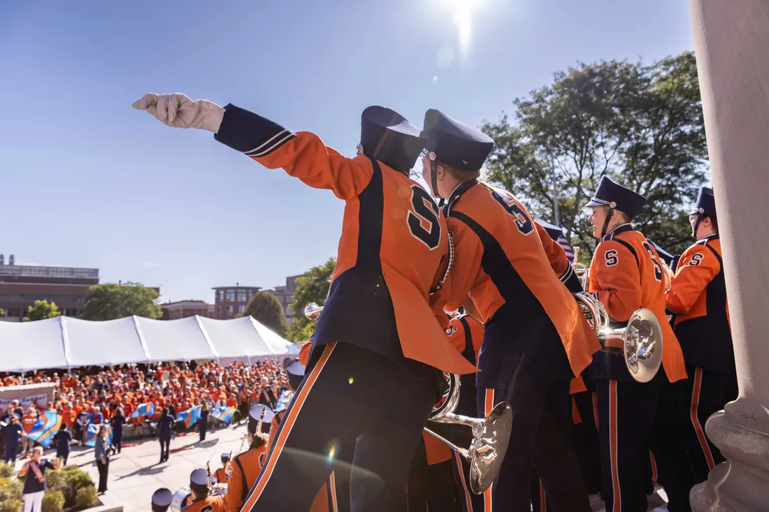 Band members at Orange Central performing in front of a crowd.