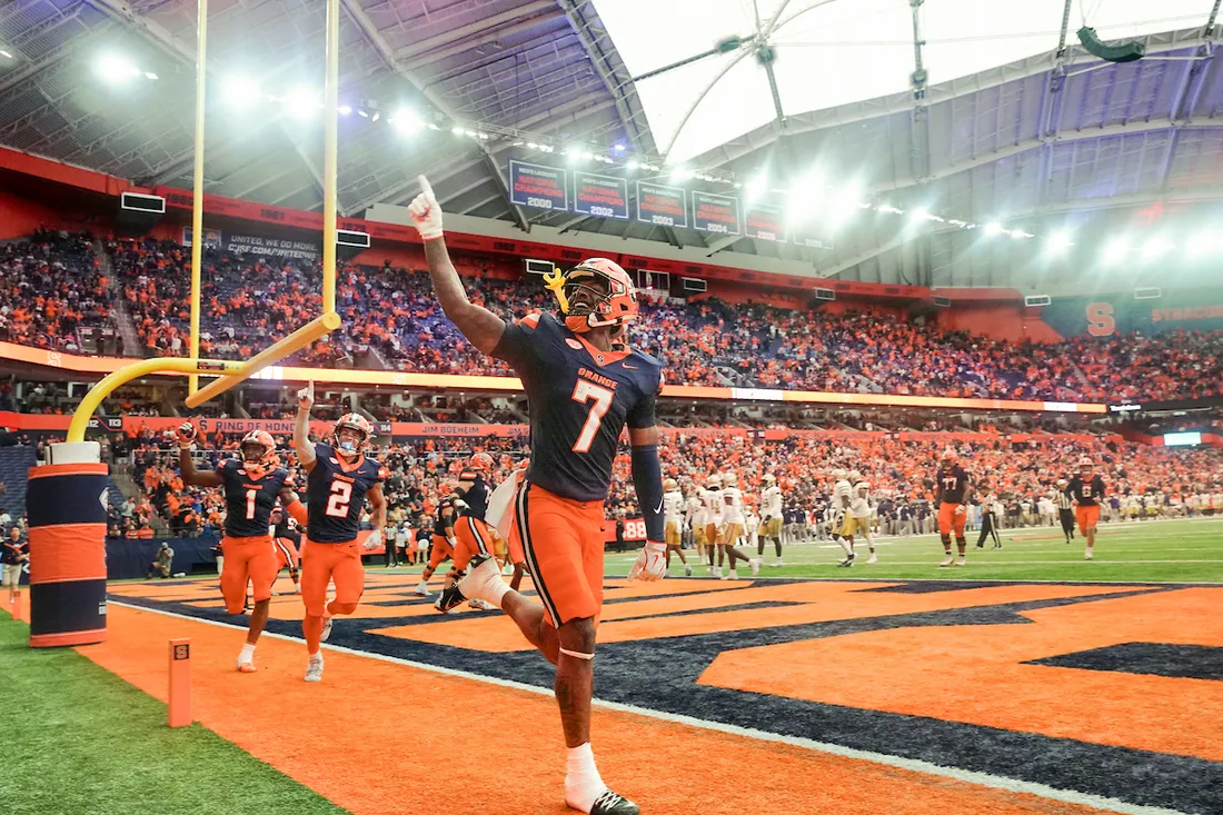 Jackson Meeks pointing to the stands of the JMA Wireless Dome.