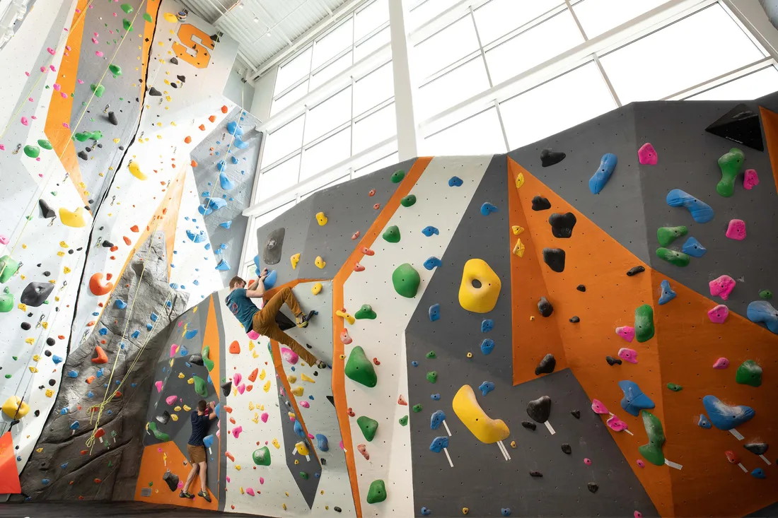 Student rock climbing at the The Barnes Center.