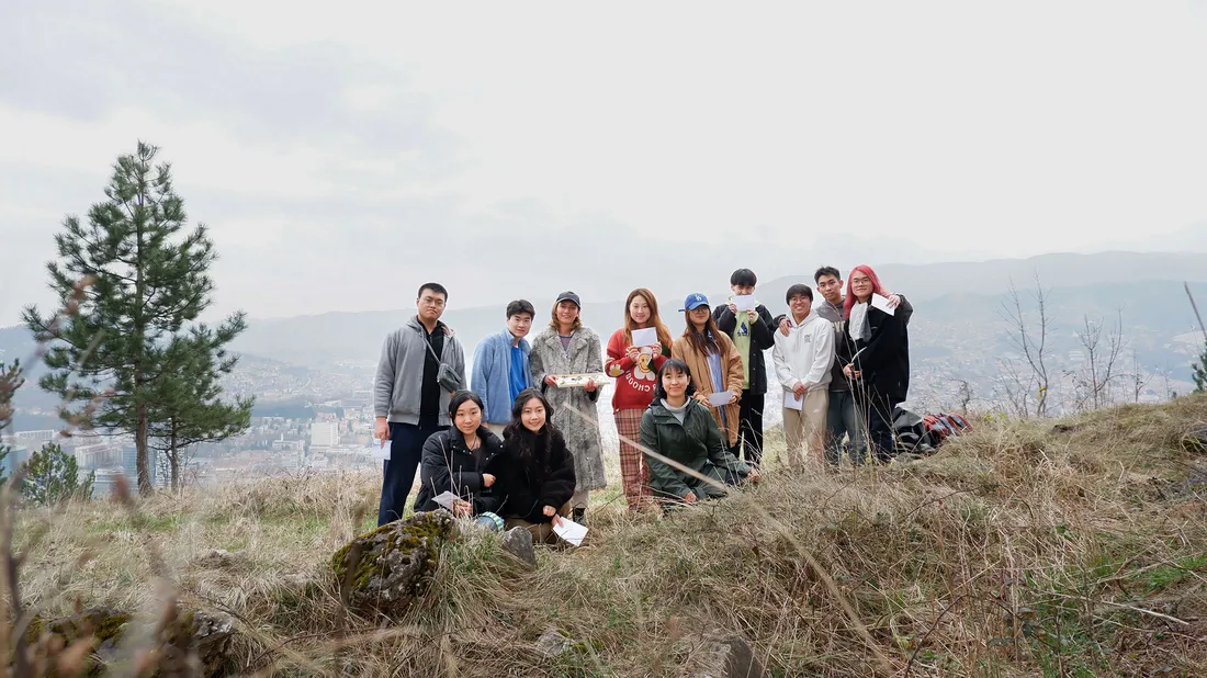 People in a field in Sarajevo Bosnia.