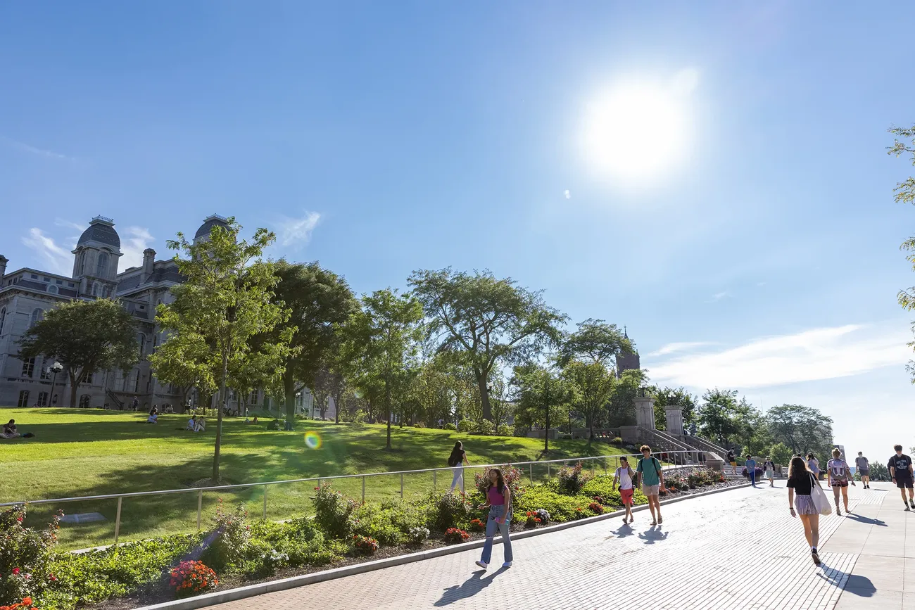 Students walk on the Einhorn Walk on a sunny summer day.