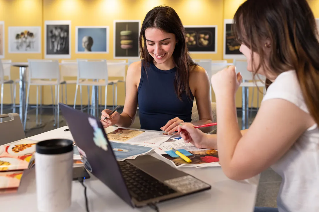 Students sitting in classroom working.