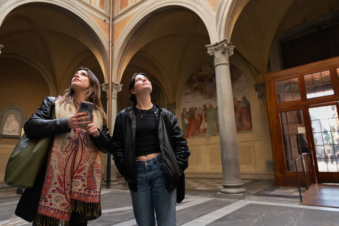 Two girls inside a building in Florence.