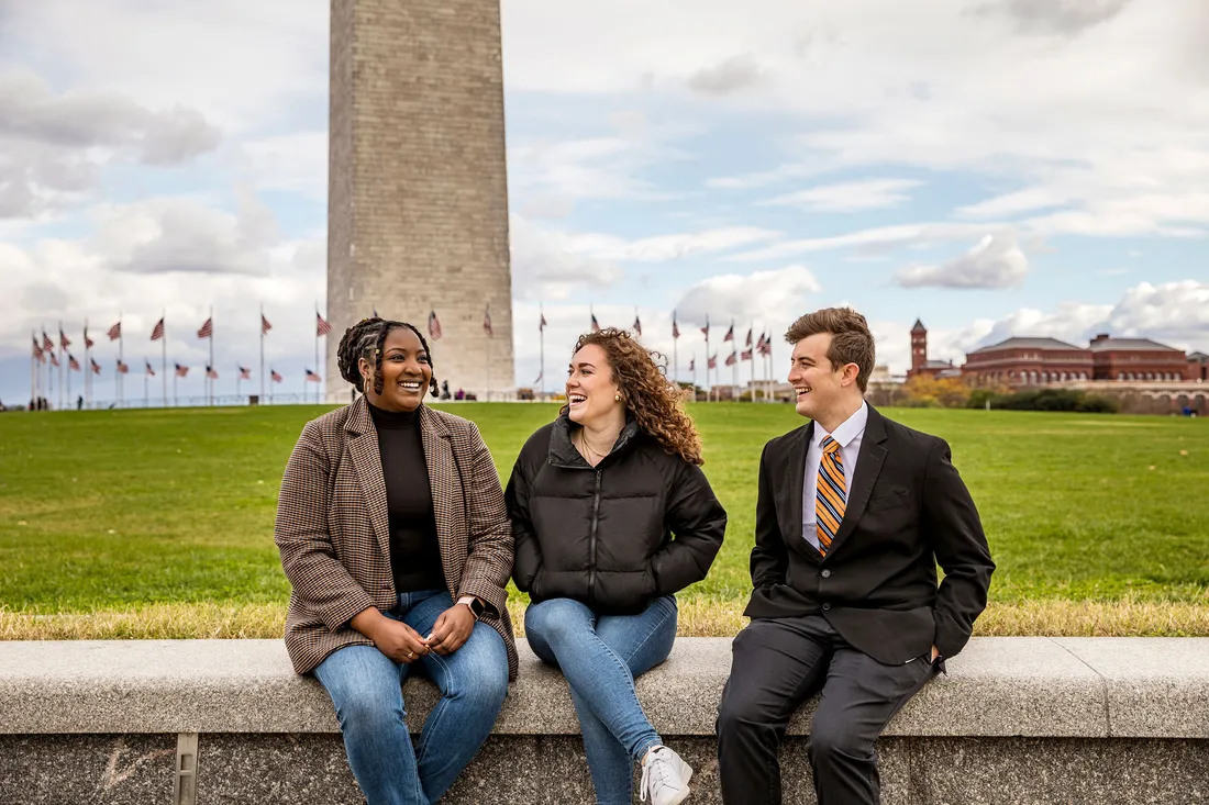 Three people sitting in Washington D.C.