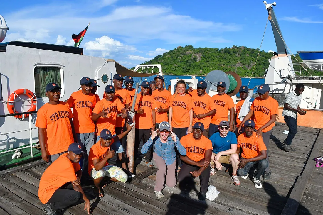 Chris Scholz research team in their Syracuse University gear.