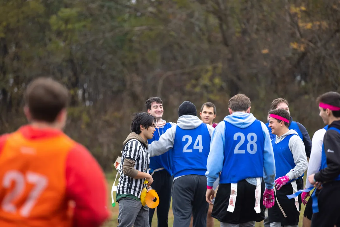 Flag football team gathering together.