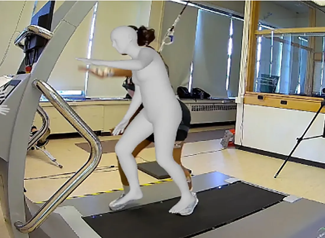 Person walking on treadmill to simulate falls.