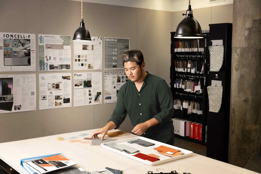 Interior Design student Jae Bin Lee works at the Nancy Cantor Warehouse.