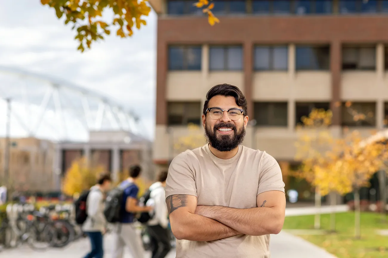 Jurgen Baeza Bernal smiling in front of the dome.