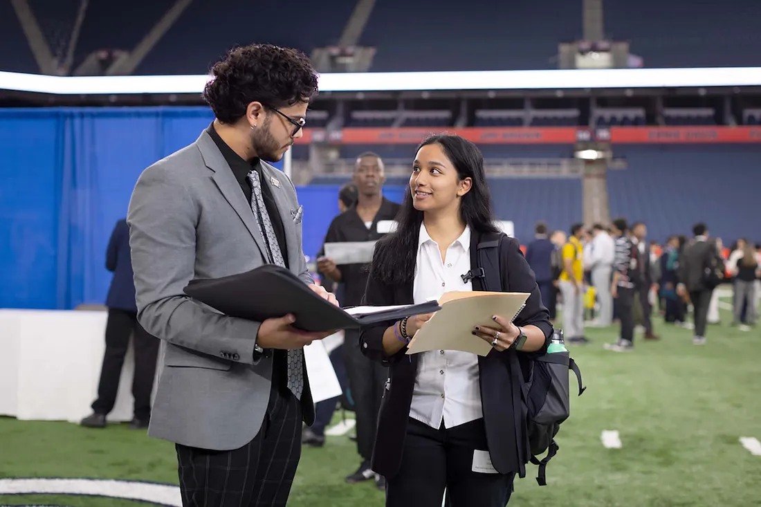 Two people at the Career Fair.