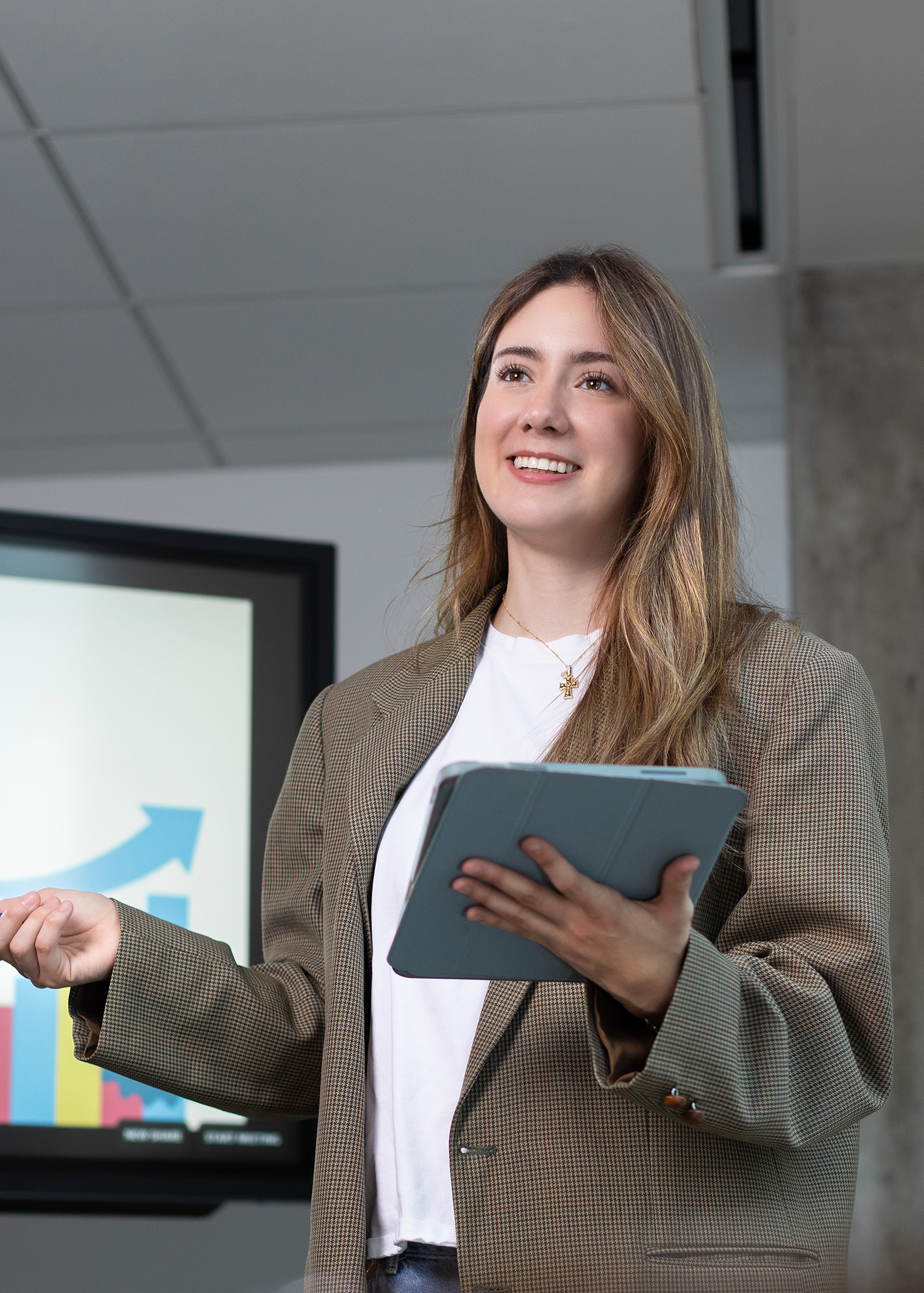 Student Isabella Chavez standing and talking in a classroom.