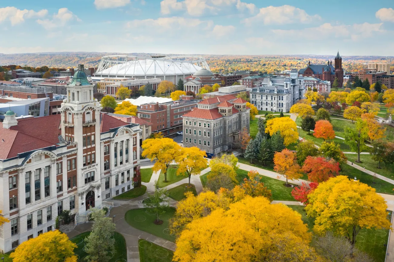 Aerial view of campus with fall foliage.