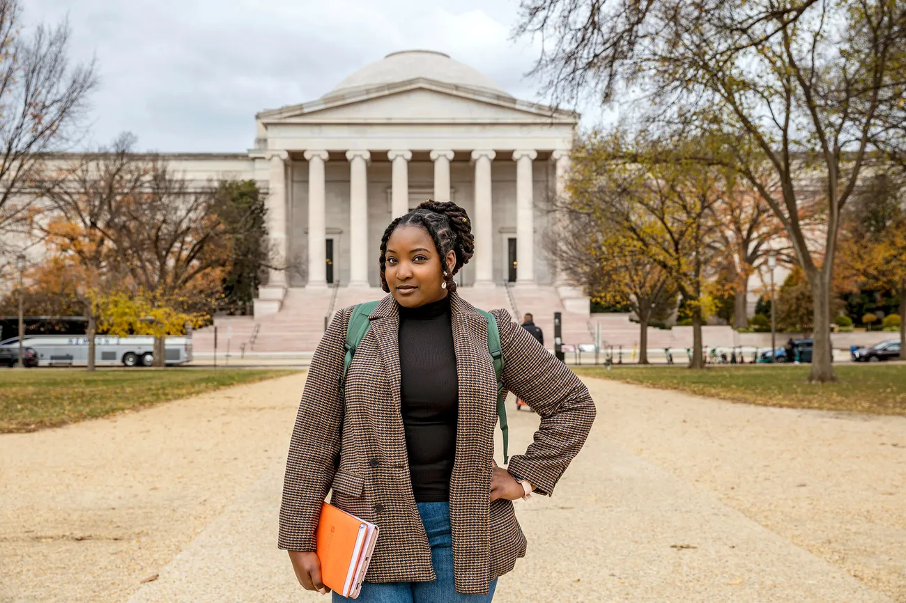 Marriler Wilson outside a building in washington.