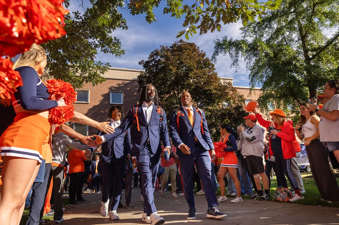 Syracuse University Football Players walking out at the Family Weekend Football game.