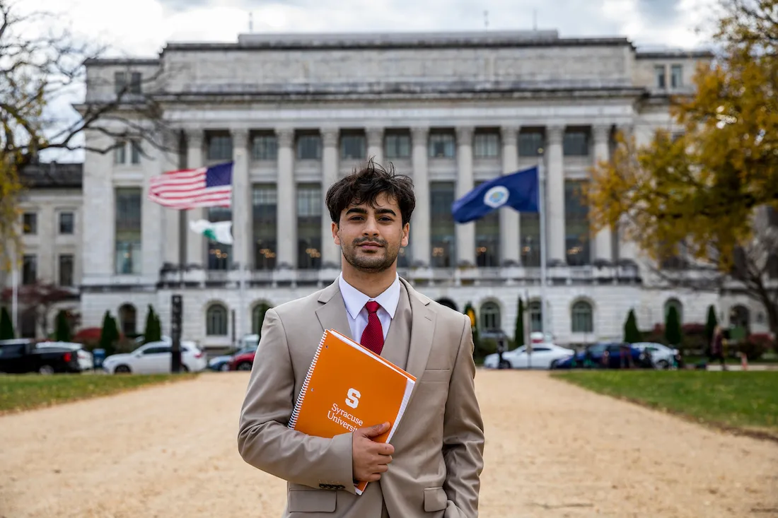 Masih Ghazanfari standing on the street in Washington D.C.