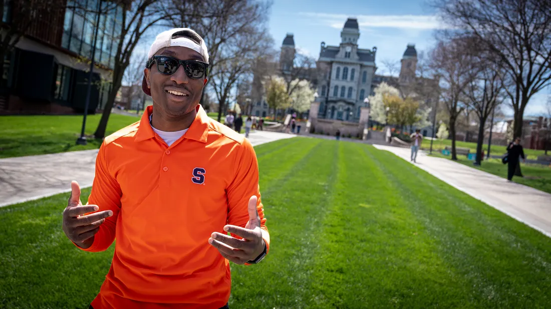 Student Michael Lupton standing outside the Hall of Languages on campus smiling.