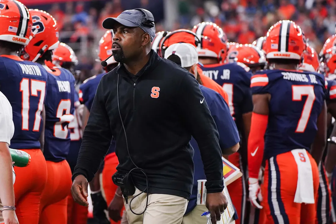 Fran Brown in front of his players.