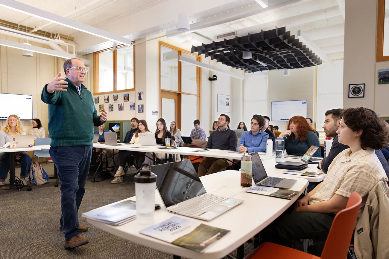 Professor Jay Golden teaching students in a classroom.