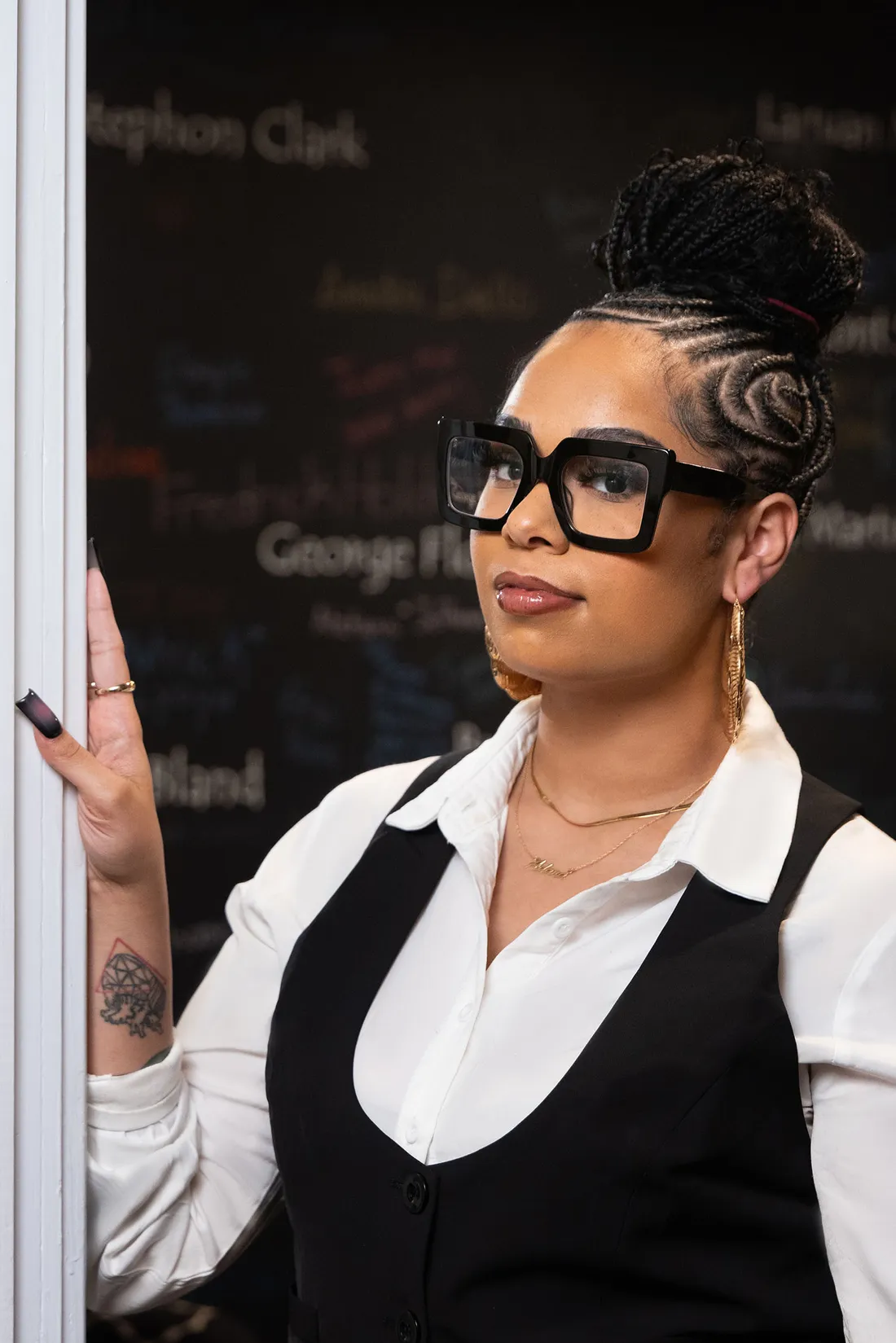 Darla Hobbs standing in front of a chalkboard.