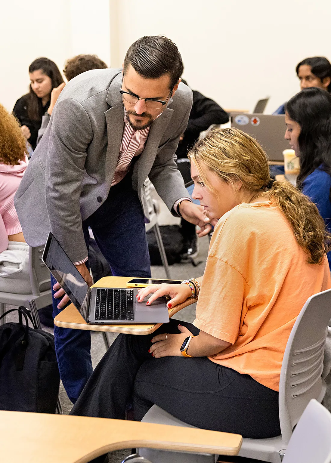 A professor working with a student.