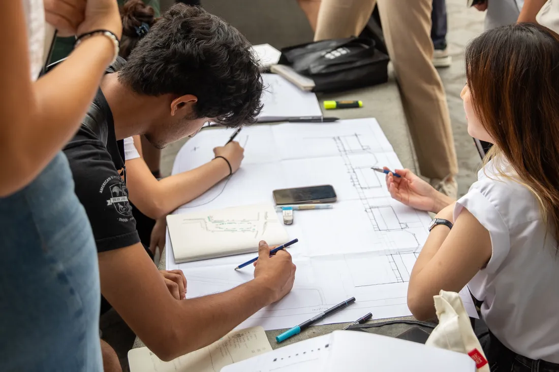 Architecture students sketching on paper in Florence, Italy.