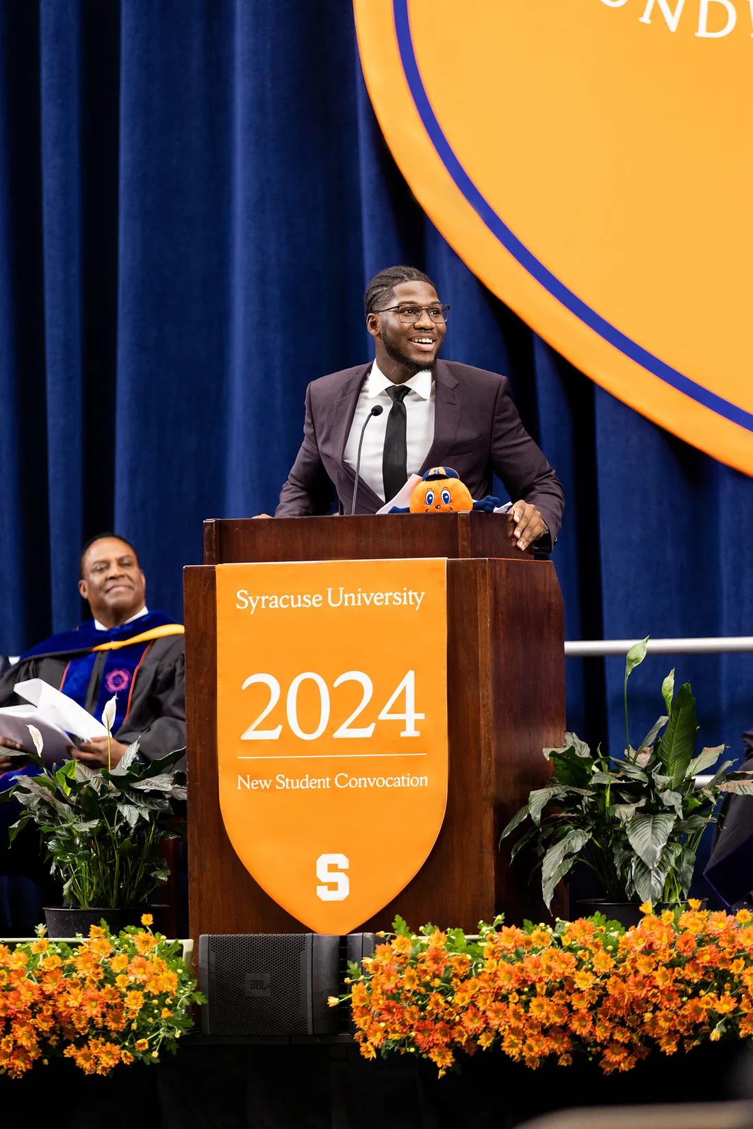 Alie Savane speaking at new student convocation.