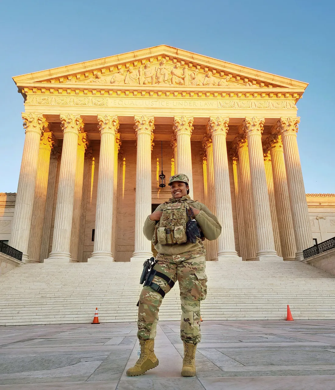 Marriler Wilson in front of a capitol building in military gear.